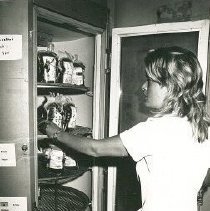 Andrea Stevens, Med Tech, inspecting blood in the Blood Bank refrigerator